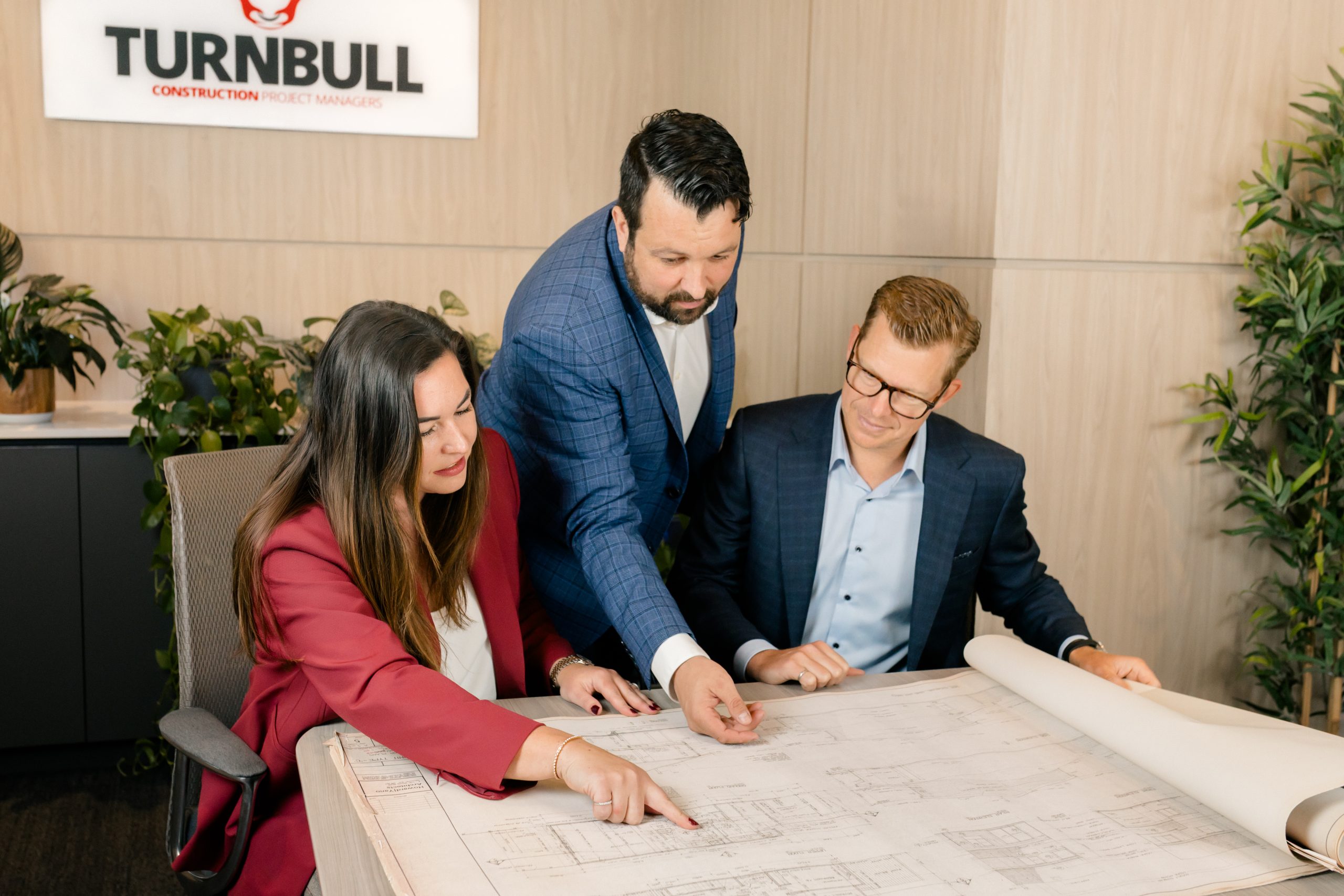 TCPM team reviewing project drawings